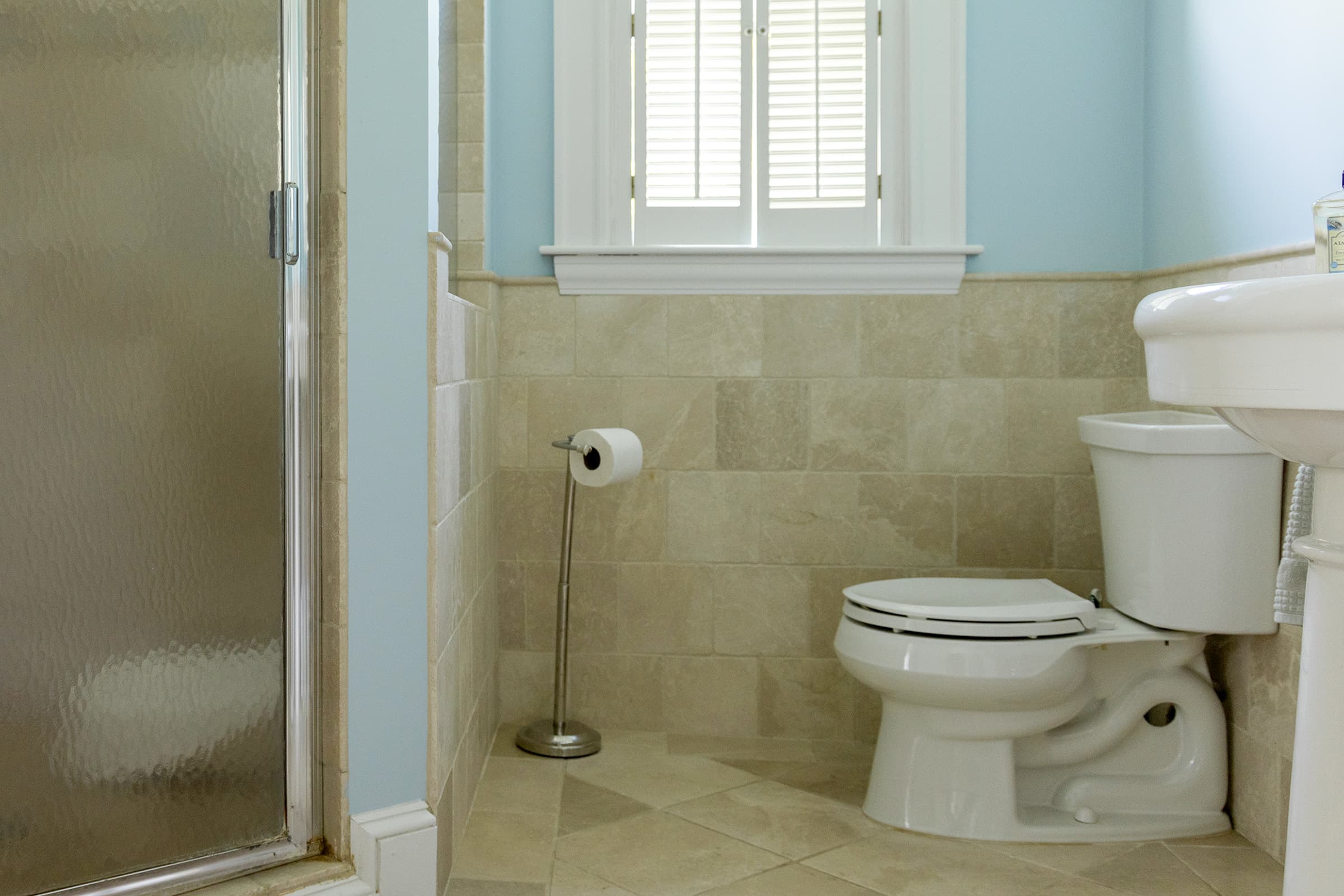 Toilet in a tiled bathroom